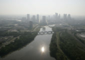 Wednesday June 8, 2011 brought temperatures to 94 F and a smog alert for central Ohio. The sun is reflected in the Scioto River looking east toward downtown Columbus, Ohio. (Dispatch photo by Craig Holman,  (ABOARD WBNS CHOPPER 10)    columbus skyline