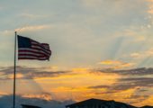 Perfect American Flag waving right after a perfect sunset