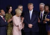 FILE - In this Jan. 3, 2020 file photo, faith leaders pray with President Donald Trump during a rally for evangelical supporters at the King Jesus International Ministry church in Miami. Trump's bond with white evangelical voters has long sparked debate. But misunderstandings persist about his support from a Christian voting bloc that favored the GOP long before he took office. (AP Photo/Lynne Sladky, File)